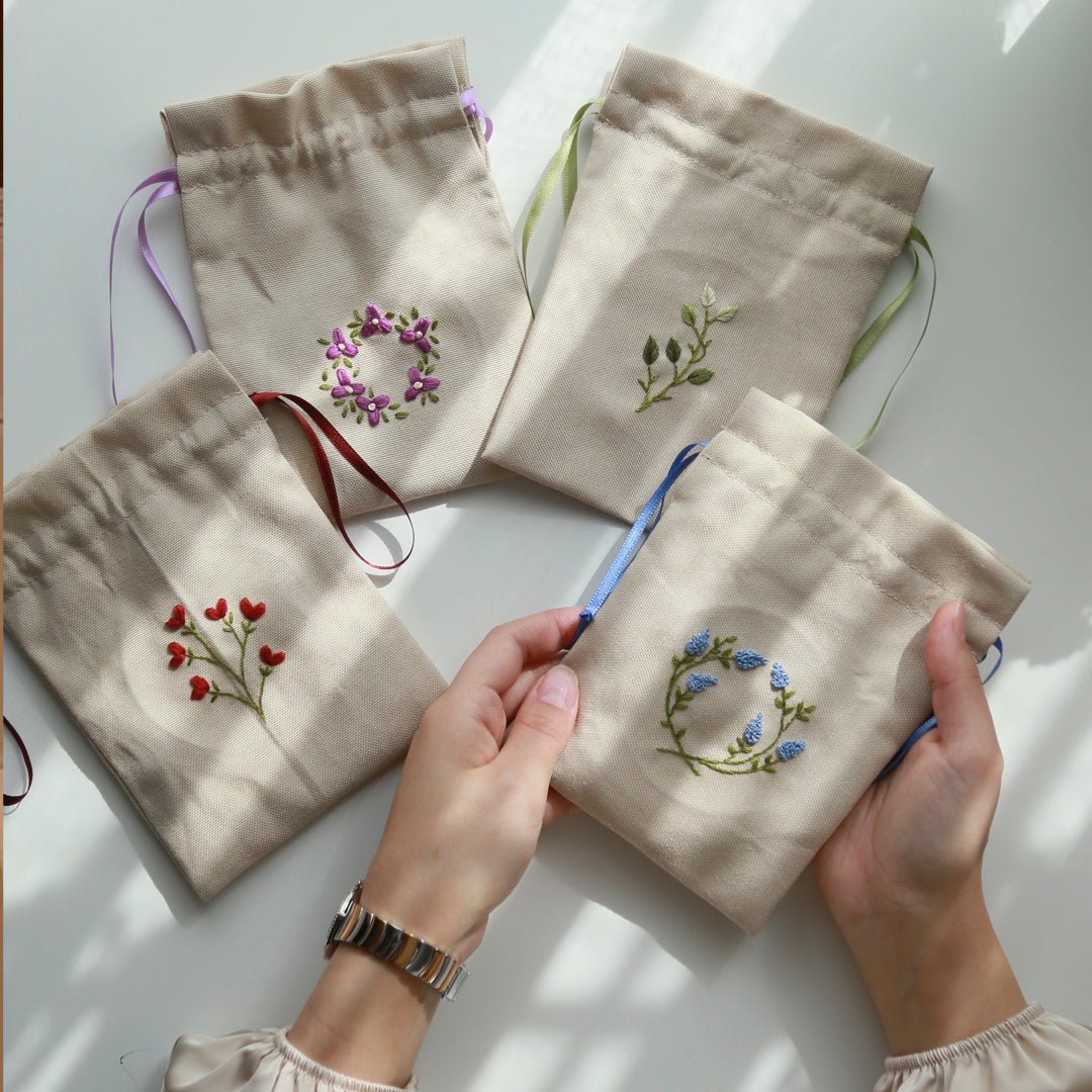 توزيعات أكياس الضيافة المطرزة